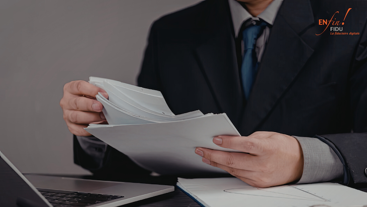 Dirigeant analysant des documents financiers pour piloter son entreprise en Suisse romande